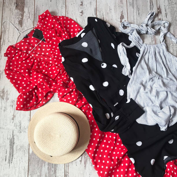 istock Black and red polka dot dresses on a wooden background 1069135422