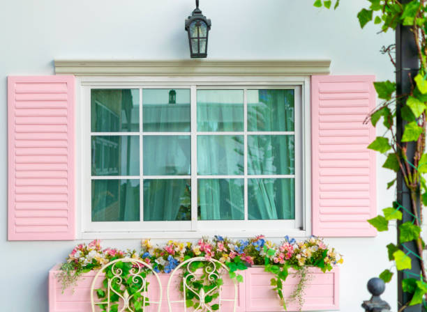 istock Windows and flowers of a pink background 1069136534