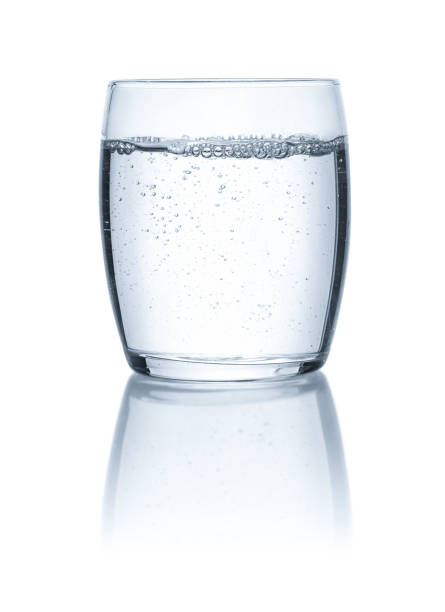 istock Glass of water on a white backgound 1069136820