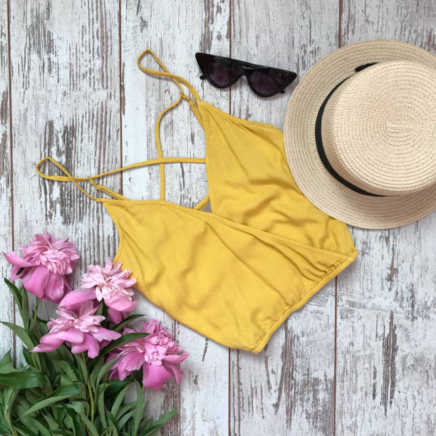 istock Yellow shirt on a wooden background 1069136936