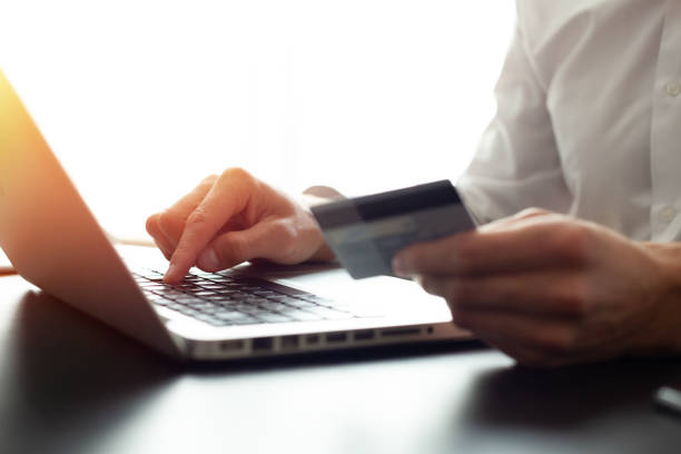 istock Hands holding credit card and using laptop. Online shopping. 1069137674