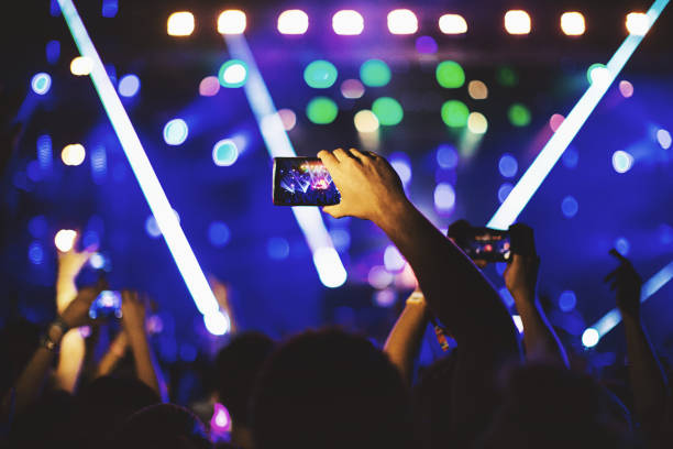 istock Unrecognizable fan filming concert with a smartphone. 1069137696