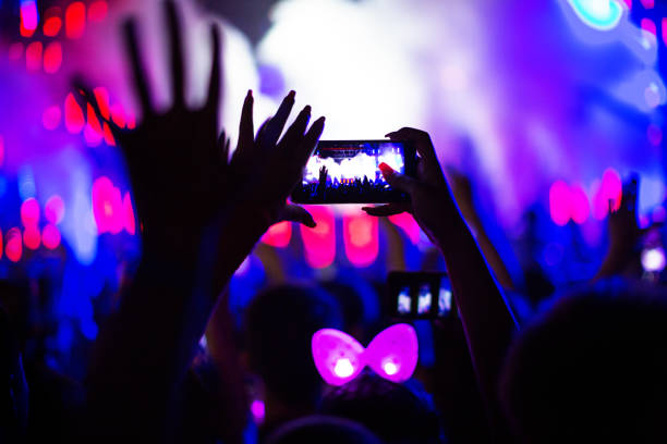 istock Unrecognizable fan filming concert with a smartphone. 1069137712