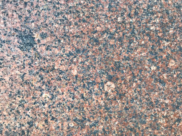 istock Granite texture. Macro photo of stone wall surface. Decorative element for interior design. Architectural detail 1069140610