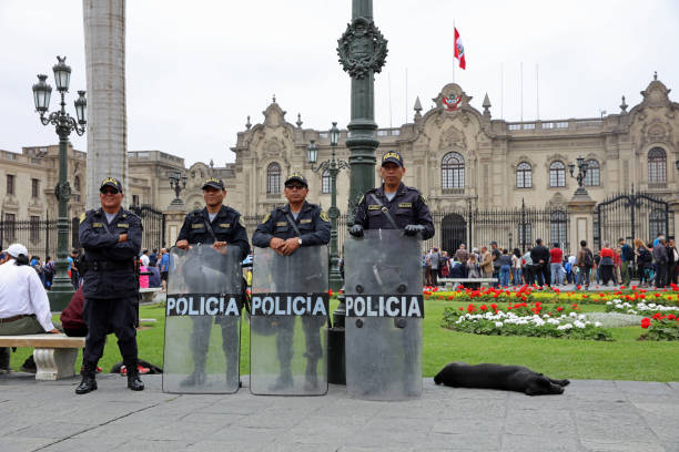 Riot Police in Front of the Government Palace, also known as the House of Pizarro, in Lima. Peru Lima, Peru – October 19, 2018: Riot Police in Front of the Government Palace, also known as the House of Pizarro, in Lima. Peru riot police stock pictures, royalty-free photos & images