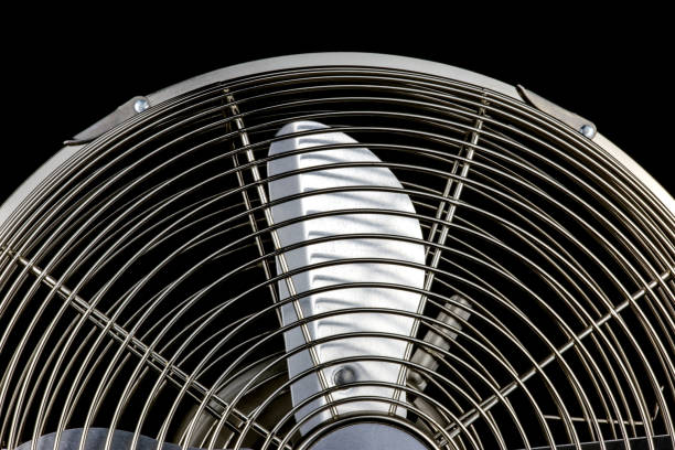 istock Steel Desk Fan on a Black Background 1069147946