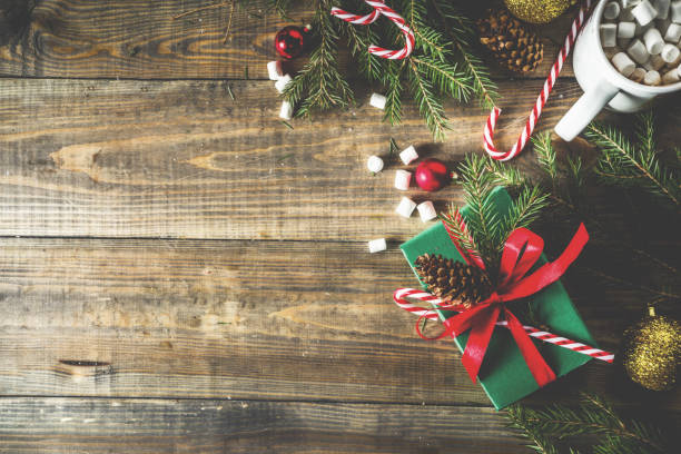 istock Christmas presents on wooden background 1069153220