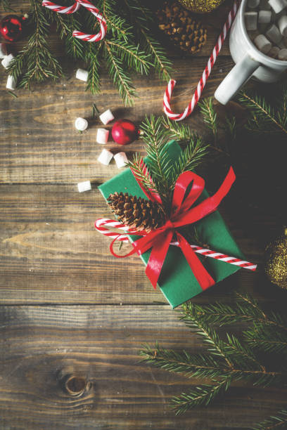 istock Christmas presents on wooden background 1069153240