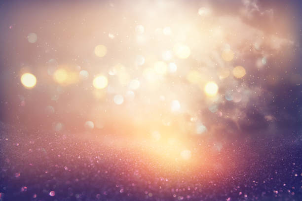 istock glitter vintage lights background. silver, pink, purple and gold. de-focused. 1069153884