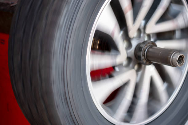 Wheel with motion during setting balancing in car shop. Wheel with motion during setting balancing in car shop. car boot stock pictures, royalty-free photos & images