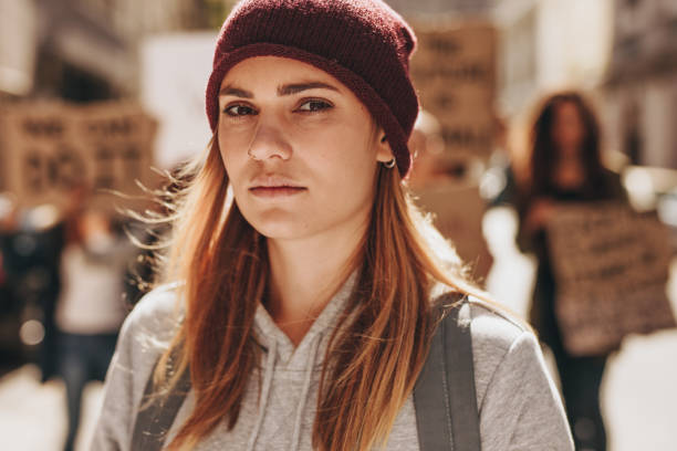 istock Female activist with group of people at the back 1069156968
