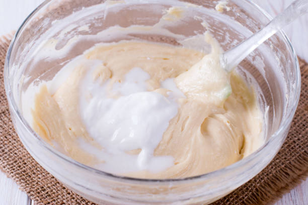 istock Mixing butter and sour cream in bowl with mixing machine 1069157054