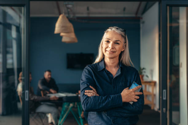 istock Smiling senior business woman at office 1069159962