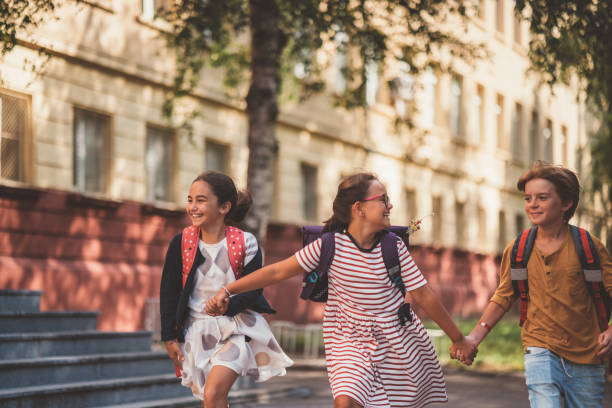 istock Joyful school children running outside 1069165862