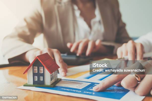 Close Up Hand Of Businesswoman Signing Contract Insurance Protecting House Stock Photo - Download Image Now