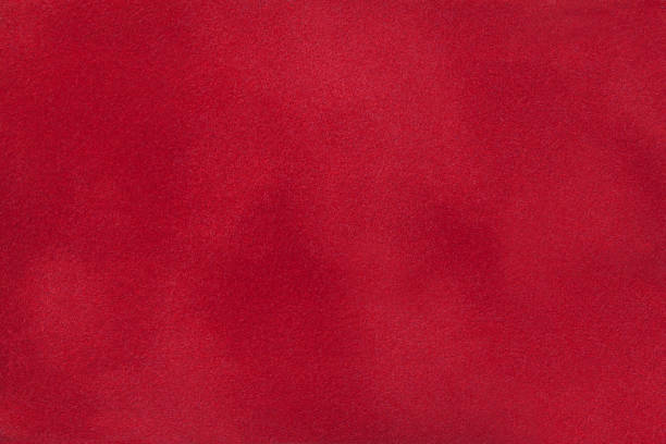 istock Dark red matte background of suede fabric, close-up. 1069167450