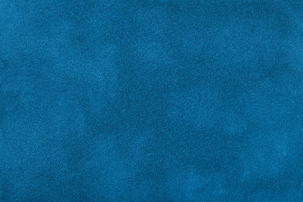 istock Dark blue matte background of suede fabric, close-up. 1069169198