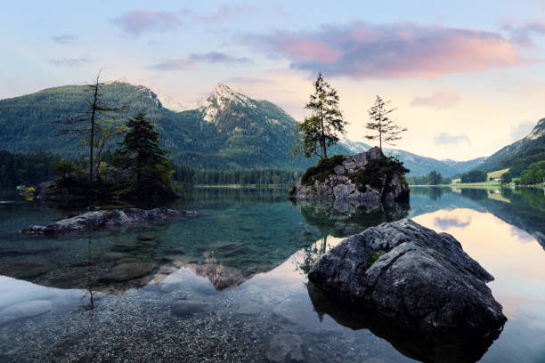 istock Hintersee alpine mountain lake and clousy colorful sunrise 1069173252