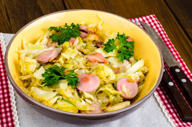 istock Stewed cabbage with slices of sausages 1069176152