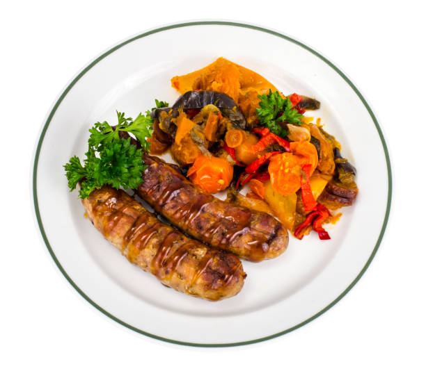 istock Grilled sausages with baked vegetables 1069176470