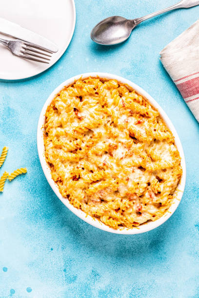 istock Mac and cheese, pasta baked with cheese sauce 1069179644