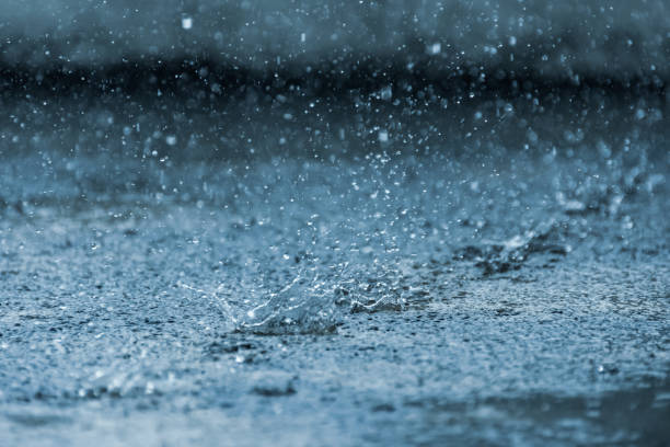 Raining on cement floor stock photo