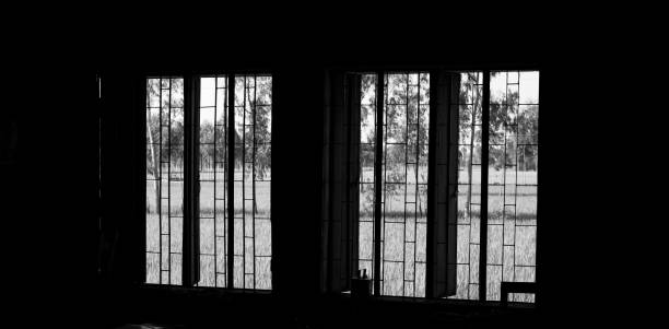 istock Windows of a dark room unique photo 1069180308