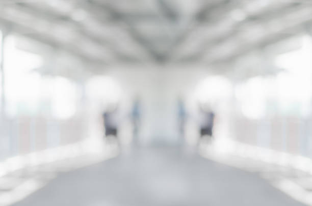 istock blur background image of empty walk way to sky train with no people abstract gray blur bokeh. 1069182480
