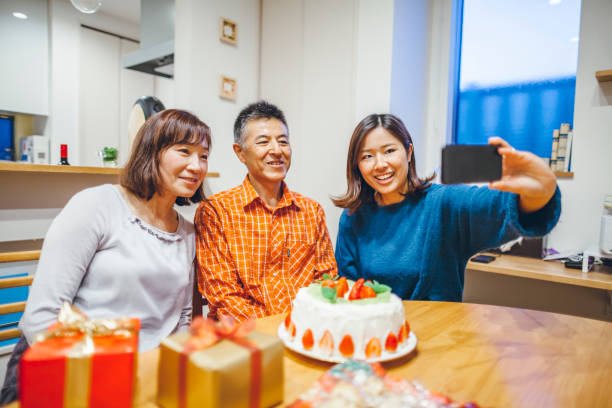 istock Family having birthday party at home 1069183486