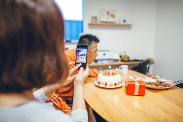 istock Married couple having birthday party at home 1069185372