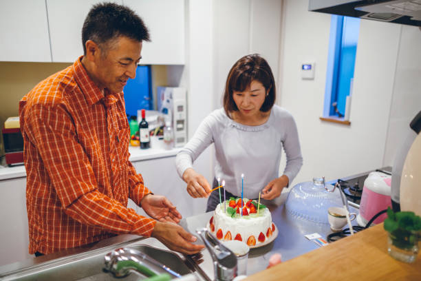 istock Married couple having birthday party at home 1069186154