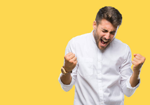 istock Young handsome man over isolated background very happy and excited doing winner gesture with arms raised, smiling and screaming for success. Celebration concept. 1069188196