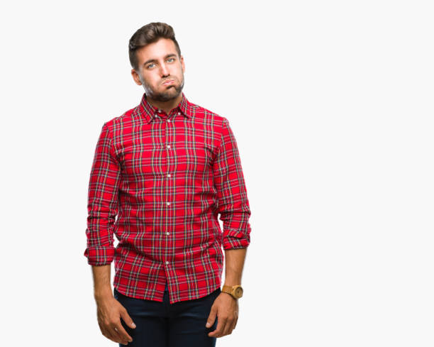 istock Young handsome man over isolated background puffing cheeks with funny face. Mouth inflated with air, crazy expression. 1069189208