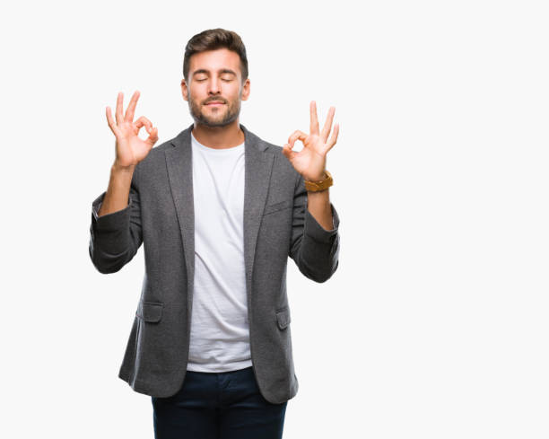 istock Young handsome business man over isolated background relax and smiling with eyes closed doing meditation gesture with fingers. Yoga concept. 1069189558