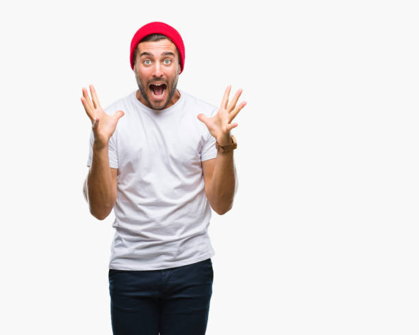 istock Young handsome man over isolated background celebrating crazy and amazed for success with arms raised and open eyes screaming excited. Winner concept 1069189588