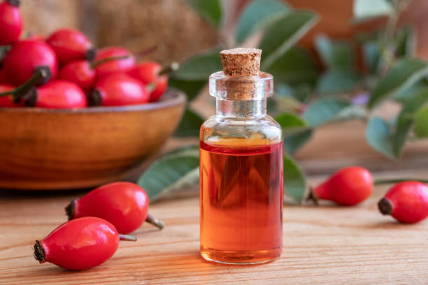istock A bottle of rose hip seed oil with fresh rose hips 1069189640