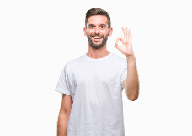 istock Young handsome man over isolated background smiling positive doing ok sign with hand and fingers. Successful expression. 1069192940