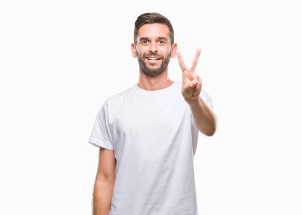 istock Young handsome man over isolated background showing and pointing up with fingers number two while smiling confident and happy. 1069192954