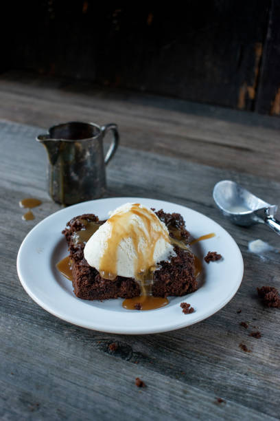 istock Caramel drizzled brownies with ice cream 1069200608