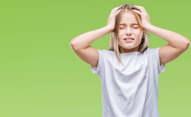 istock Young beautiful girl over isolated background suffering from headache desperate and stressed because pain and migraine. Hands on head. 1069201222