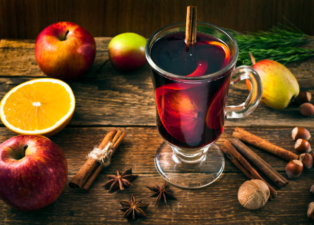 istock Hot mulled wine with spices, orange, nuts and apples. 1069204346