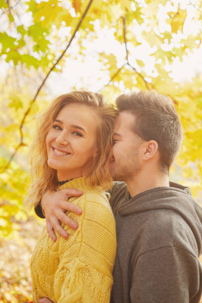 istock Young couple in love in autumn forest 1069207012
