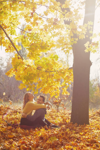 istock Young couple in love in autumn forest 1069208352