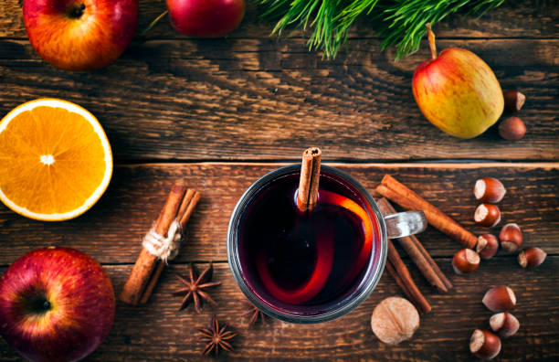 istock Hot mulled wine with spices, orange, nuts and apples. 1069208660