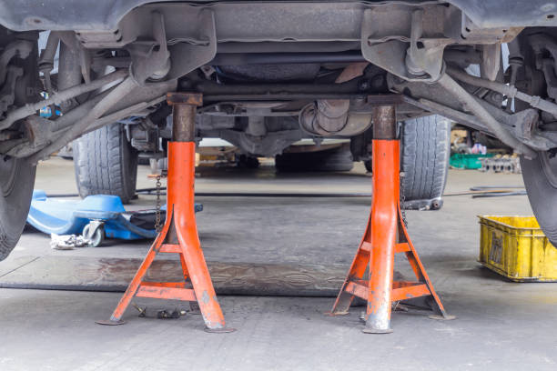 istock Car repaie service, Car sitting on jack stand 1069211206