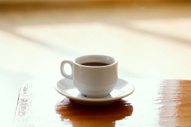 istock soft focus white coffee cup on a wooden table 1069212744