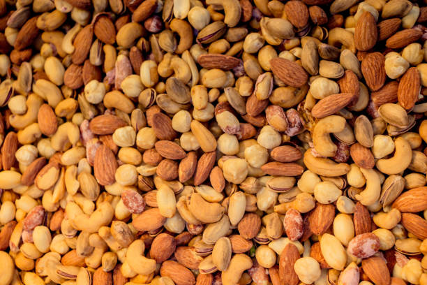 istock Pile of assorted nuts and seeds on display 1069213112