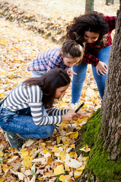 istock three girls exploring outdoors 1069224022