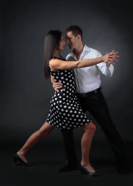 istock Couple in love dancing in the Studio. 1069224246
