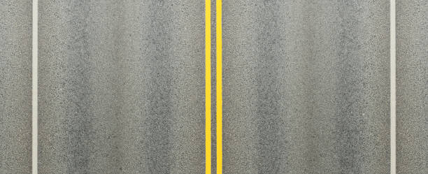 istock Asphalt road and double yellow lines dividing the lanes. 1069226892